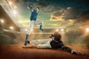 Baseball players in action, one sliding into a base while the other throws the ball