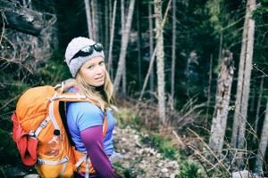 Blonde hair woman hiking in the cold